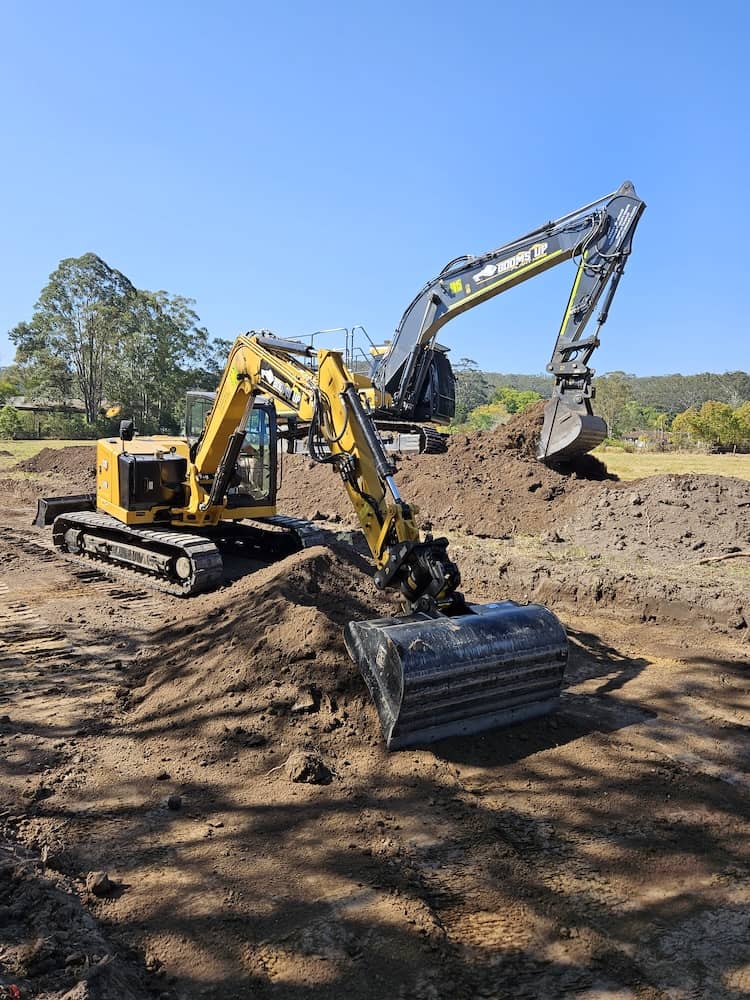 two excavators at work digging